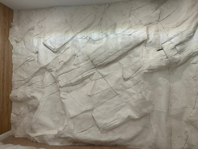 A Large Wall Covered by the White Andes Wall Panel