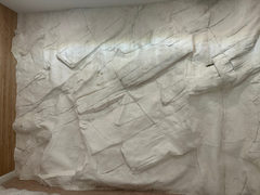 A Large Wall Covered by the White Andes Wall Panel