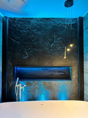 A Bathroom Wall covered by The Dragonstone Panel and Illuminated with Blue LEDS