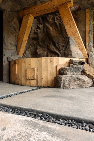 Malawi Panel mounted against back corner walls of wooden hot tub with rock steps