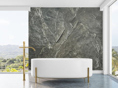 A Modern Bathroom and Bathtub with large windows, and the Slate Wall Panel Behind the Tub