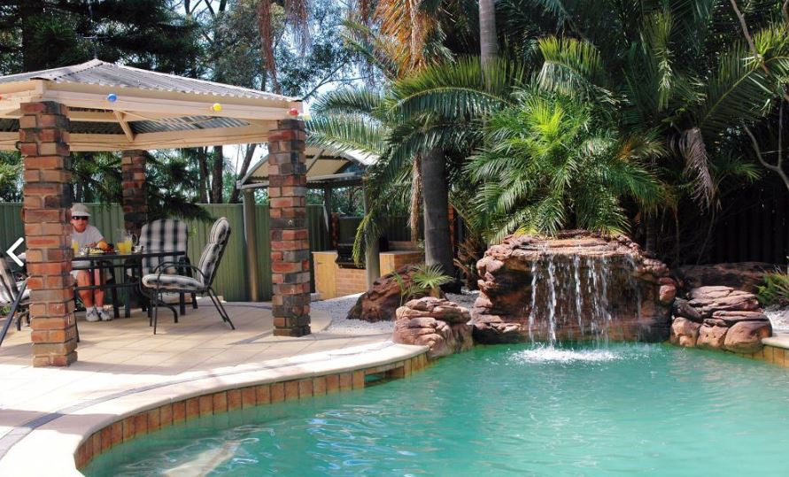 Photo of The Oasis - Swimming Pool Waterfall - PCAVE-004 by Universal Rocks - Marquis Gardens